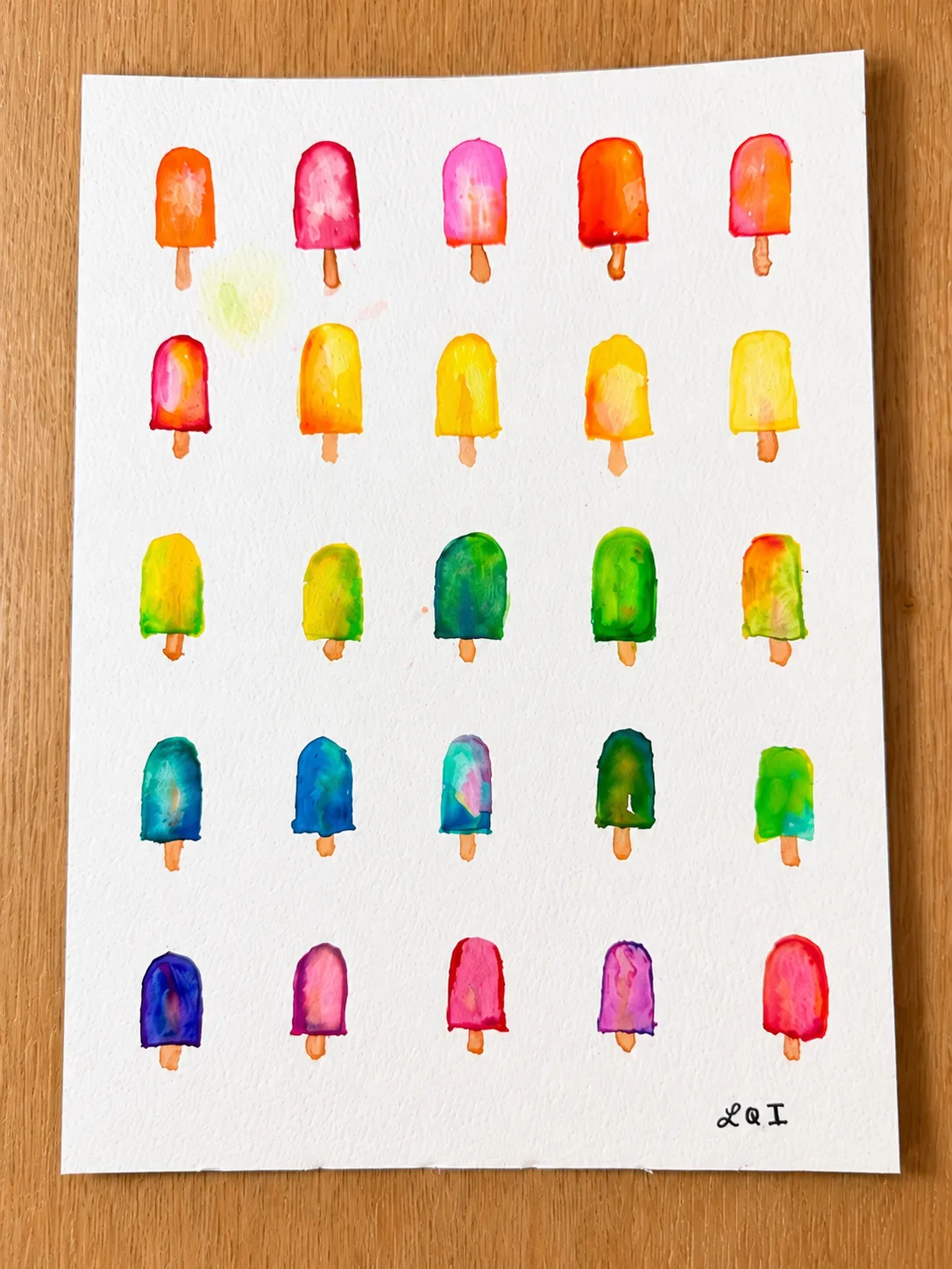 Summer Popsicles viewed from overhead on a wooden worktable