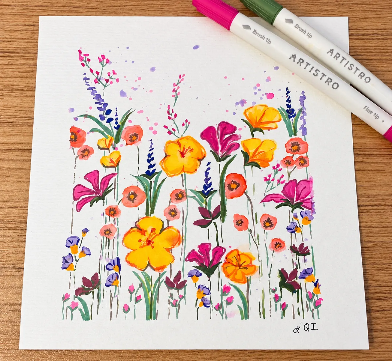 Wildflowers, no. 2 on a wooden table beside brush markers